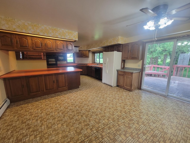 5330 500th St, Kenyon Twp, MN 55946 - kitchen featuring black appliances, a ceiling fan, and a peninsula