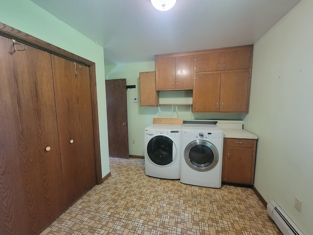 5330 500th St, Kenyon Twp, MN 55946 - laundry area featuring baseboard heating, washer and dryer, cabinet space, and light floors