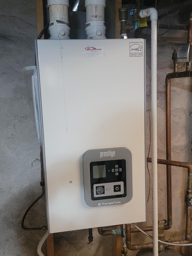 5330 500th St, Kenyon Twp, MN 55946 - utility room featuring tankless water heater