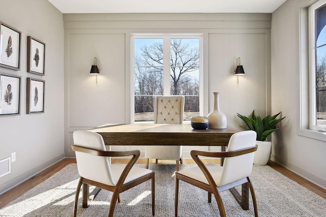 dining room with wood-type flooring