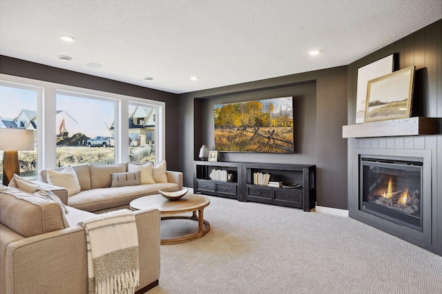 carpeted living room with a textured ceiling