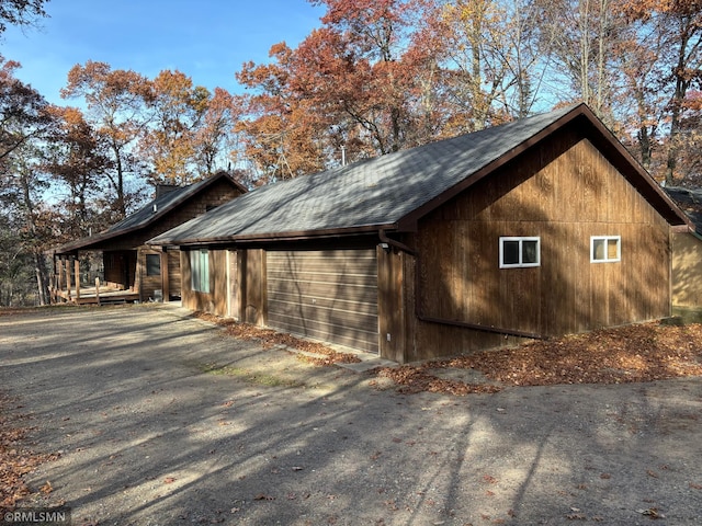 view of side of property featuring a garage