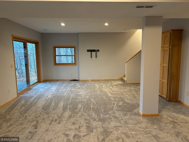 unfurnished living room featuring carpet floors