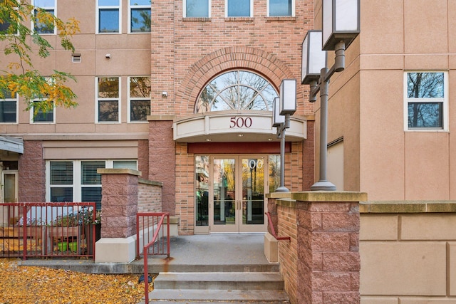 property entrance featuring french doors