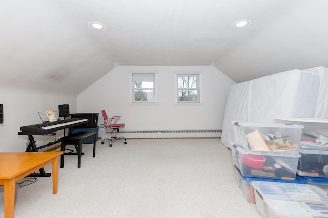 office space with carpet, lofted ceiling, and baseboard heating