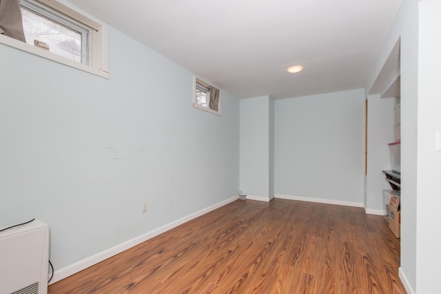 basement with wood-type flooring and a wealth of natural light