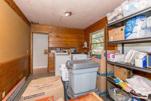 storage room featuring washer and clothes dryer and baseboard heating