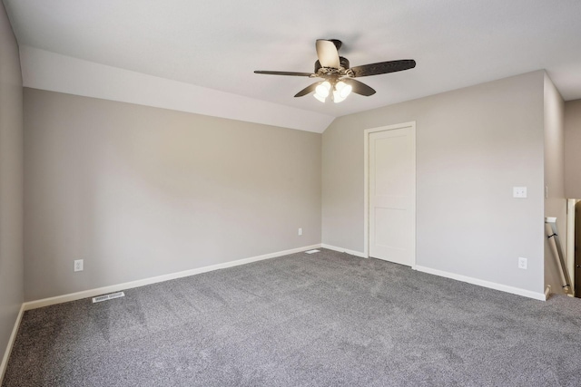 carpeted empty room with lofted ceiling and ceiling fan