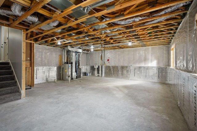 basement featuring heating unit and water heater