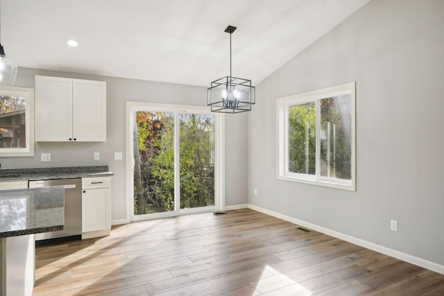 kitchen featuring white cabinetry, dishwasher, and plenty of natural light