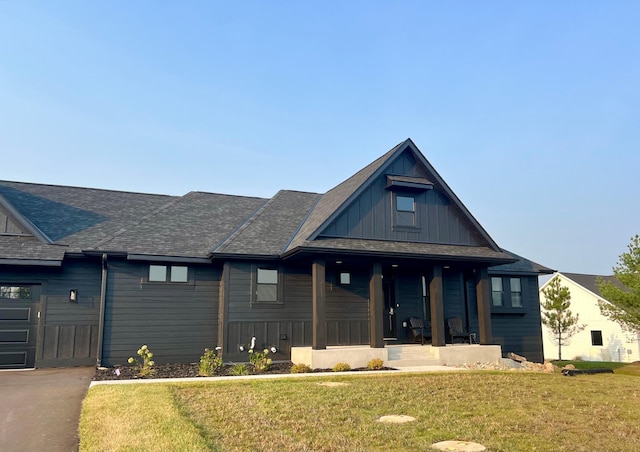 view of front of house featuring a front yard and a porch