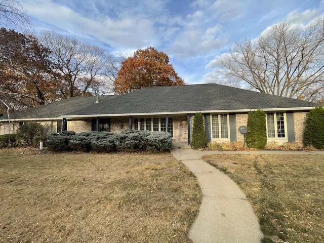 ranch-style home with a front yard