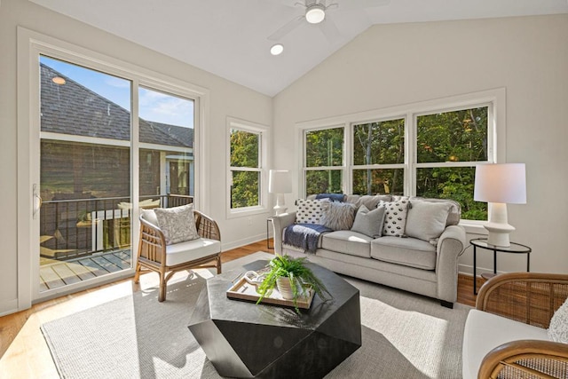 sunroom featuring ceiling fan and vaulted ceiling