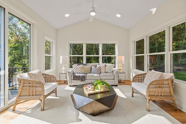 sunroom featuring ceiling fan and lofted ceiling with beams