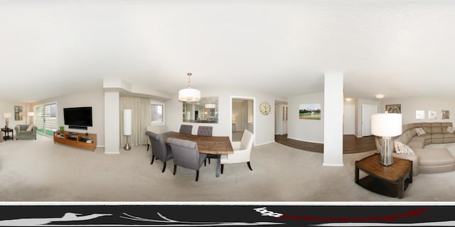 dining area featuring carpet flooring and lofted ceiling