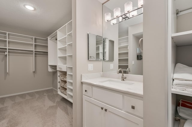 bathroom with vanity and a textured ceiling