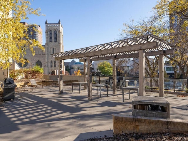 surrounding community with a patio area and a pergola