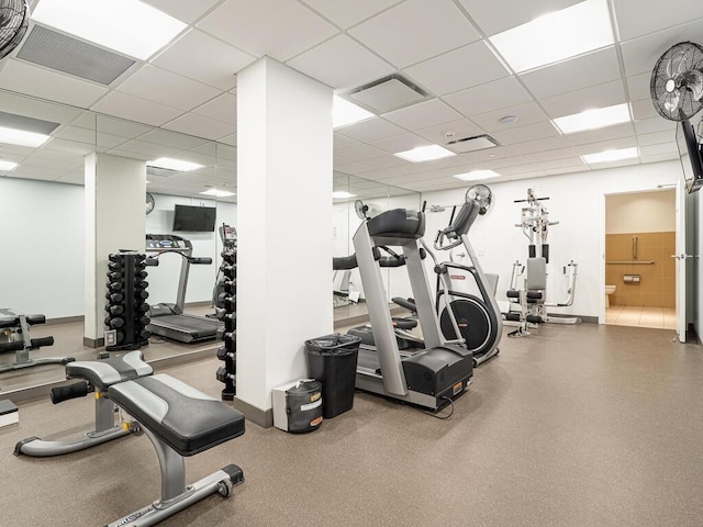 gym featuring a drop ceiling