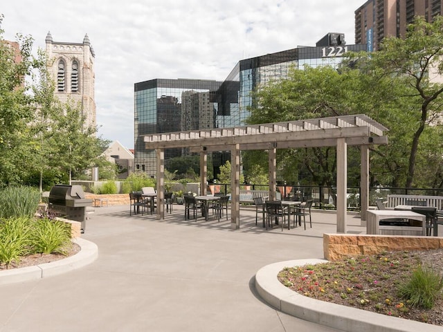 view of community with a pergola and a patio