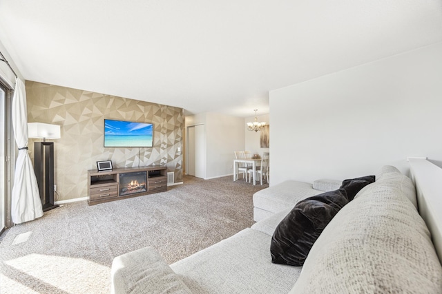 carpeted living room featuring an inviting chandelier