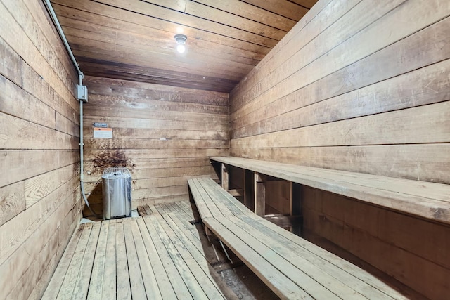 view of sauna with wood walls, wooden ceiling, and hardwood / wood-style floors