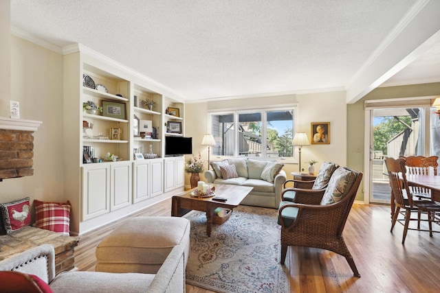 living room featuring crown molding, a textured ceiling, light hardwood / wood-style floors, and plenty of natural light