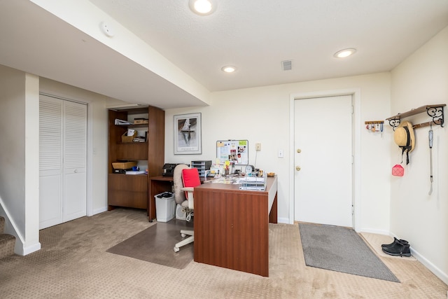 home office with light colored carpet