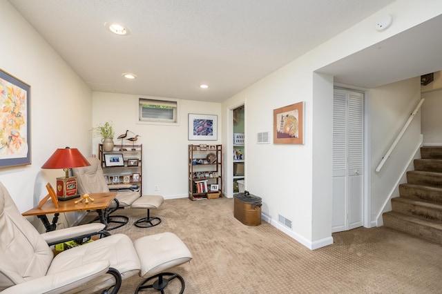 sitting room with light colored carpet