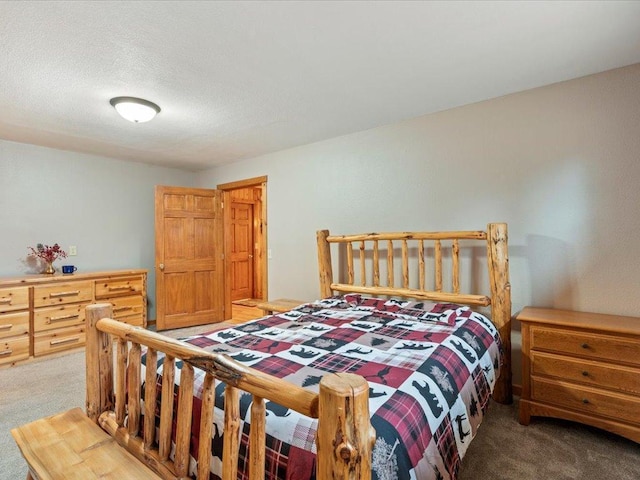 bedroom with dark carpet