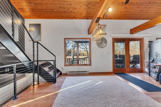 entryway with wood ceiling, baseboard heating, and plenty of natural light