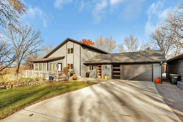 view of front of home with a front lawn and a garage