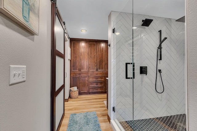 16568 Maplewood Rd, Wakefield Twp, MN 56320 - bathroom with a shower stall and wood finished floors