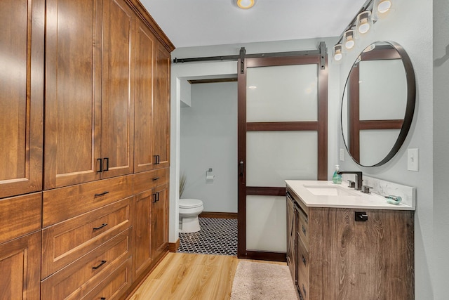 16568 Maplewood Rd, Wakefield Twp, MN 56320 - bathroom with vanity, toilet, and baseboards