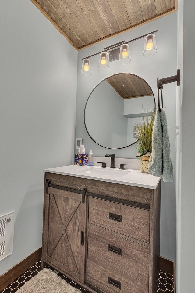 bathroom featuring tile patterned floors, vanity, and wooden ceiling