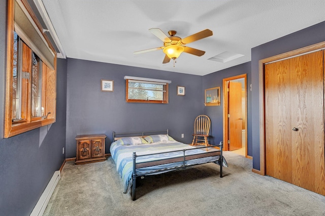 16568 Maplewood Rd, Wakefield Twp, MN 56320 - bedroom with carpet, a baseboard heating unit, baseboards, and a closet