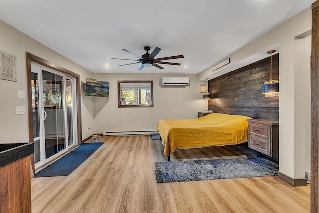 16568 Maplewood Rd, Wakefield Twp, MN 56320 - bedroom featuring baseboard heating, a wall unit AC, wood finished floors, access to exterior, and recessed lighting