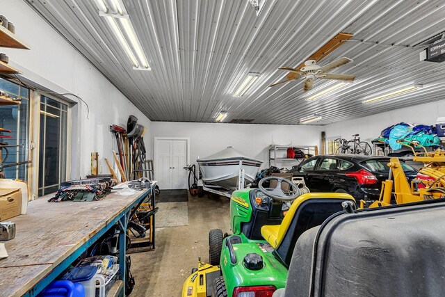 garage featuring a workshop area and ceiling fan