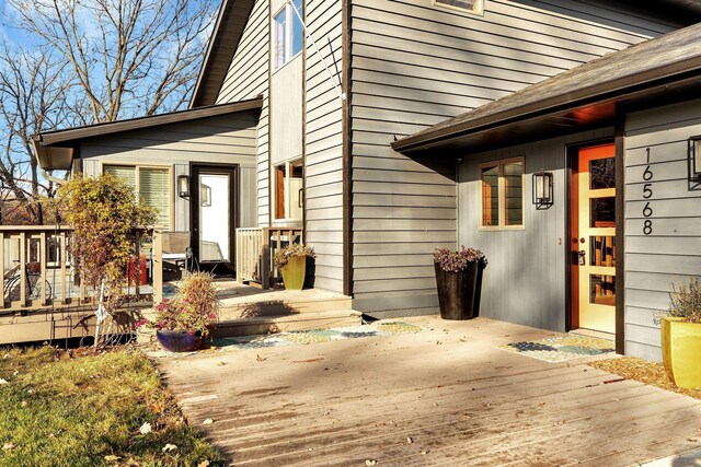 doorway to property with a deck