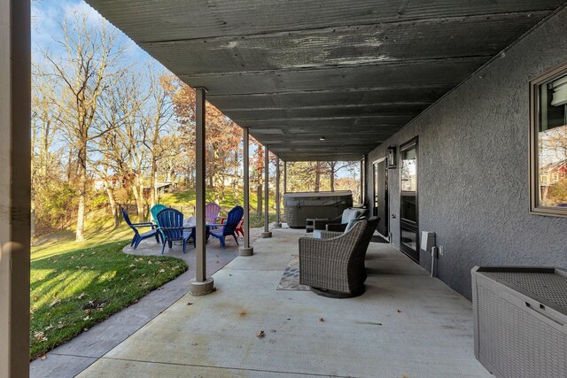 view of patio / terrace featuring a hot tub