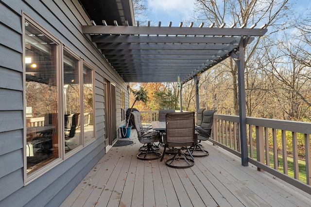 16568 Maplewood Rd, Wakefield Twp, MN 56320 - wooden deck featuring outdoor dining area and a pergola