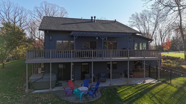 back of property with a patio area, a yard, and a wooden deck