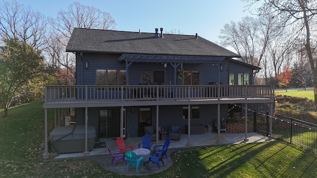 16568 Maplewood Rd, Wakefield Twp, MN 56320 - back of house with a wooden deck, a patio, roof with shingles, and a hot tub