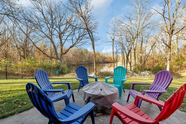 view of patio featuring grilling area and a water view