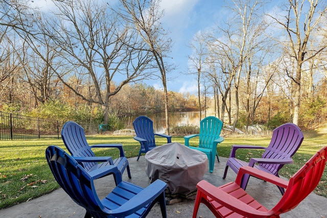 16568 Maplewood Rd, Wakefield Twp, MN 56320 - view of patio with an outdoor fire pit and a water view