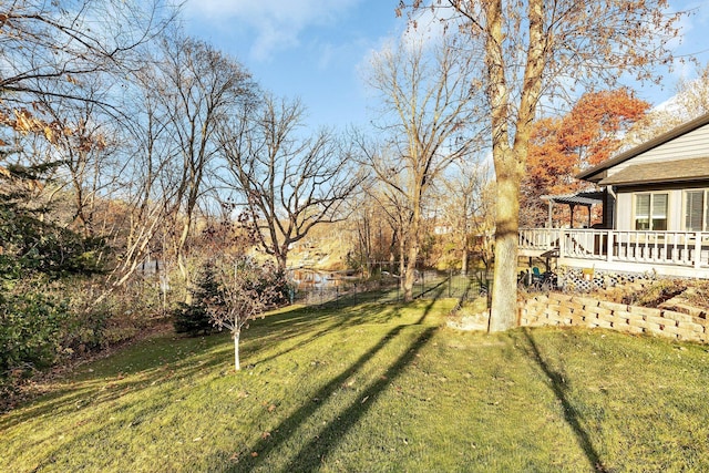16568 Maplewood Rd, Wakefield Twp, MN 56320 - view of grassy yard with a wooden deck