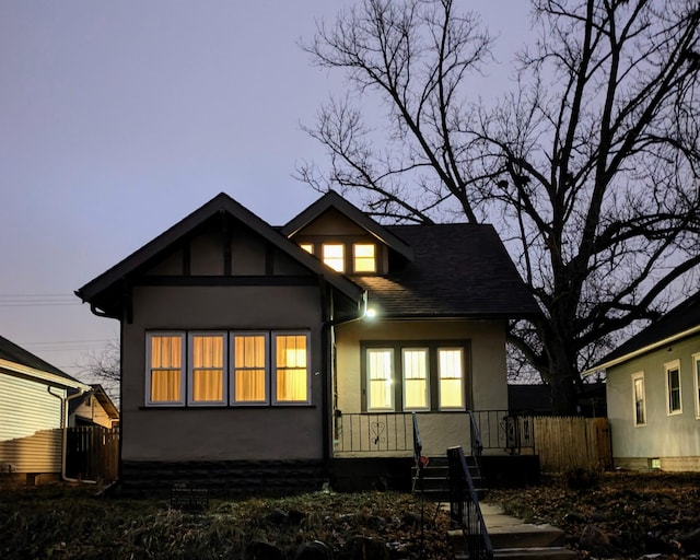 view of back house at dusk