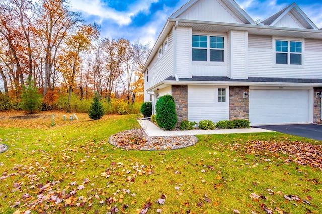 view of front of house featuring a front yard and a garage