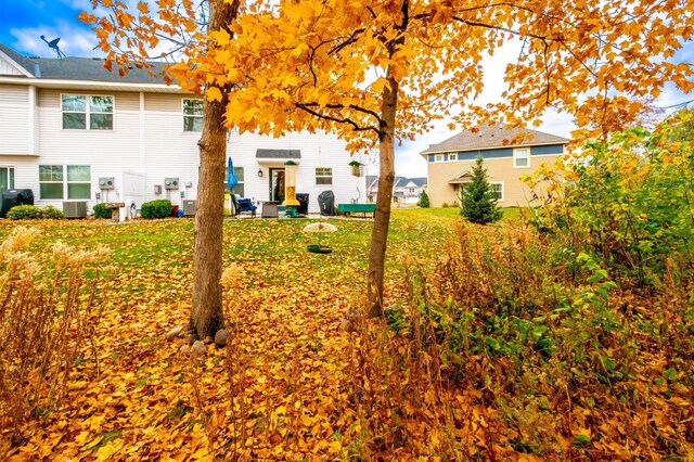 view of yard with a patio area and central AC unit