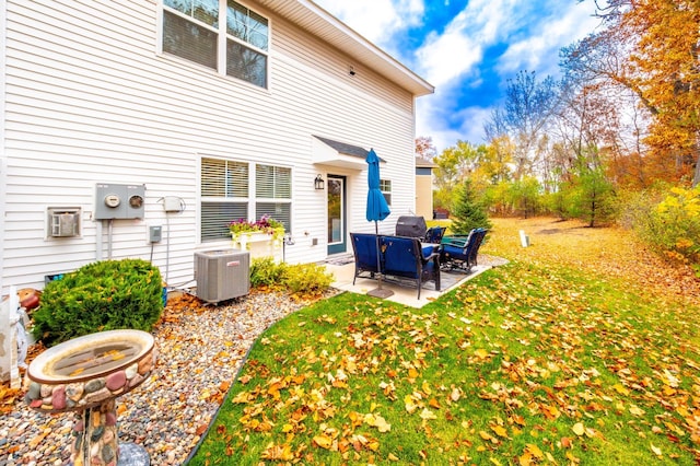 view of yard with a patio and central AC