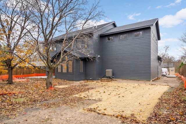 view of side of property with central AC unit